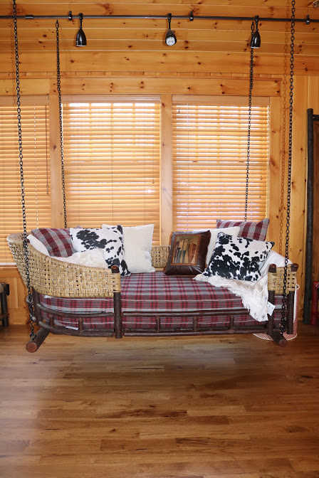 hanging porch swing lakeside living red plaid dalmatian print pillows woven siding wi