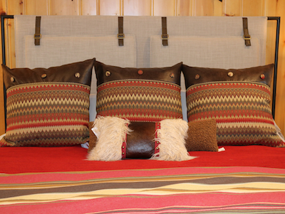 lakeside-living-design-northwoods-wi-cabin-decor-patterned-pillows-reds-orange-brown-diamond-fabric