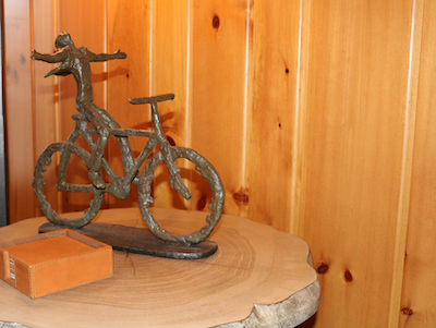 lakeside-living-design-northwoods-wi-cabin-decor-sculputre-woman-on-bike